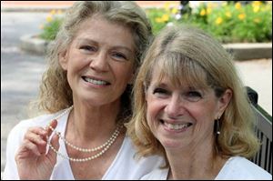 Judy Conibear, left, and her sister, Karen Bracken, with special jewelry that once belonged to their mother.