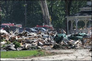 Little remains of nine buildings of a South Toledo apartment complex that caught fire, causing an estimated $5 million loss.