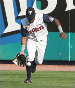 Mud Hens right fielder Timo Perez fields a hit against Scranton/Wilkes-Barre in last night s game at Fifth Third Field.