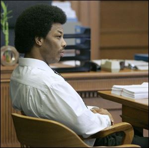 Goldy Thompson listens as his murder trial gets under way in Lucas County Common Pleas Court. Thompson's attorney said yesterday that prosecutors will not be able to link his client to the 2006 killings. Thompson's brother, Stoney Thompson, has been convicted and sentenced to three consecutive life prison terms.