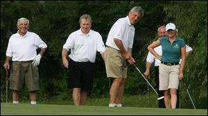 Jamie Farr, left, Jim Murray, Gary Benz, Alan Brass, and pro golfer Mhairi McKay enjoy the Toledo Edison/ProMedica Health System Pro-Am.
<br>
<img src=http://www.toledoblade.com/graphics/icons/photo.gif> <font color=red><b>VIEW</font color=red></b>: <a href=