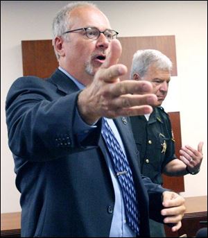 Slug: CTY sheriff17p              Date: 7/16/2008             The Blade/Amy E. Voigt       Location: Toledo, Ohio  CAPTION:  Rodney Hartzell, Deputy, U.S. Marshals, left, and Sheriff James A. Telb, right, address the media about operation FALCON 2008 at the Lucas County Sheriff's office on July 16, 2008.