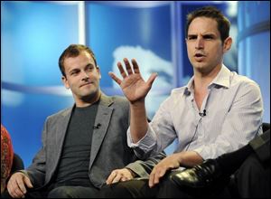 Eli Stone star Jonny Lee Miller, left, listens as executive producer Greg Berlanti discusses the second season of the show.
