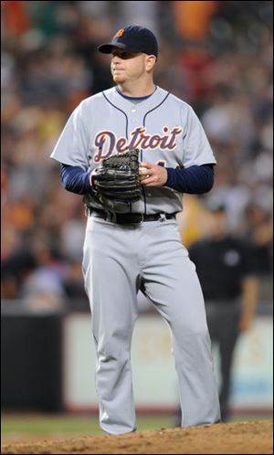 A frustrated Bobby Seay waits for Luke Scott to round the bases after hitting a two-run home run in the eighth inning.