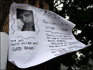 This sign was posted yesterday near Idaho and White streets, where Kenneth Kimble was fatally shot Friday evening. A neighbor said a few people exchanged punches before the shooting.