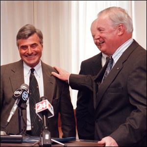 James Hartung and Mayor Carty Finkbeiner were all smiles when they appeared at a press conference in December, 1998.