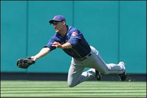 Grady Sizemore makes a diving catch in the seventh inning of yesterday afternoon's game against the Angels. Sizemore contributed his 25th home run to the Tribe's 14-hit attack.