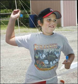 NBRW berkey 24p  7/20/2008  blade photo by herral long  Reece Hanna 10 of sylvania tosses dart at festival  Berkey's annual chicken barbecue at Lathrop park Berkey