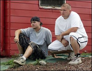 Jamel Jomaa, left, and Louie Perry, who witnessed the shooting incident, said police repeatedly told the gunman to yield.
