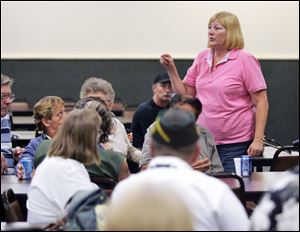 Pam Parker, co-founder of Opponents of Ohio Bans, speaks to a group at Somerset Hall last night. The group is urging business owners affected by the state smoking ban to rally support for a legislative effort to modify the ban. 