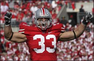 The Buckeyes' James Laurinaitis was named the Big Ten's
preseason defensive player of the year for a second time.