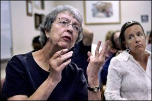 Mary Rose Donahue of Toledo says during a hearing at TARTA headquarters that proposed service cuts will force her to ride three TARTA buses to get her to where she needs to go. (THE BLADE/DAVE ZAPOTOSKY)
<br>
<img src=http://www.toledoblade.com/assets/gif/weblink_icon.gif> <font color=red> <b>READ</font color=red></b>: <a href=