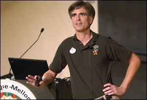 Randy Pausch delivers his final lecture in September to a standing-room-only crowd in Carnegie Mellon University's McConomy Auditorium in Pittsburgh. He died yesterday.