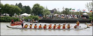 The seventh annual Great Maumee River Dragon Boat Festival drew more than 1,200 paddlers on 44 teams who were
raising money for Partners in Education, a nonprofit organization that promotes partnerships between schools and
other groups. Yesterday s event was presented by BP in International Park.
<BR>
<img src=http://www.toledoblade.com/graphics/icons/photo.gif> <b><font color=red> VIEW</b></font color=red>: <a href=