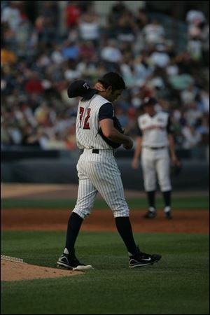 Hens pitcher Virgil Vasquez shows his frustration after giving up a home run. He allowed four homers and six runs in 21/3 innings.