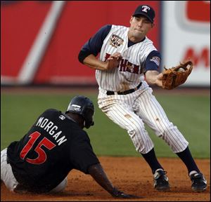 The Mud Hens  Michael Holliman tries to make the tag as Indy s Nyjer Morgan steals second base during the fourth inning.
