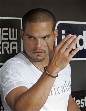 Ivan Rodriguez talks with reporters yesterday in Cleveland after finding out he'd been traded by the Tigers to the Yankees.