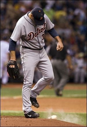 Detroit starter Kenny Rogers kicks the resin bag after walking
Tampa Bay s Carl Crawford during the fourth inning.