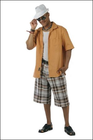 Plaid shorts and an open short-sleeve shirt are worn with a fedora.