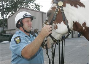 Officer Greg Zattau and KO get ready to ride.
<br>
<img src=http://www.toledoblade.com/graphics/icons/photo.gif> <font color=red><b>VIEW</font color=red></b>: <a href=