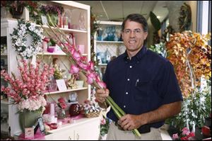 Frank Viviano, owner of Bartz Viviano Flowers, said a single claim by a temporary worker sent his premiums skyrocketing.
