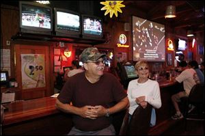 Mike Hohol and his wife, Karen, of South Toledo relax after a few games of Keno at the Fricker s restaurant in Maumee.
