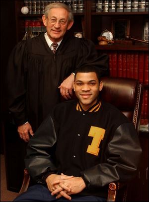 Judge Richard Warren, former guardian for University of Toledo
ex-basketball player Sammy Villegas, said he urged Mr.
Villegas to  tell the truth and cooperate. 
