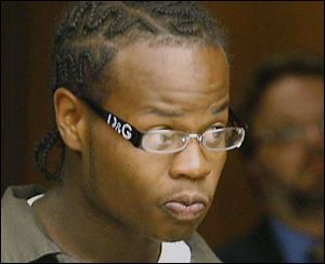 Dymon Bolton being arraigned for murder and aggravated robbery Friday. 
