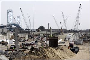 The complex will feature nine new bridges, including one that will loop around from the Ambassador Bridge s border-crossing area to feed southbound I-75.
