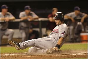 Ryan Garko scores on a sacrifice fly to put the Indians up 3-1 in the fourth inning. Things fell apart for the Tribe in the sixth.