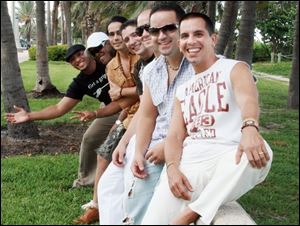 The members of Tiempo Libre, from front to back, are Jorge Gomez, Luis Beltran Castillo, Ra l Rodr guez Hernandez,
Joaquin Diaz, Tebelio Fonte Pedraja, Leandro Gonzalez, and Hilario Bell.
