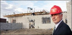 Hugh Caumartin, superintendent of Bowling Green Schools, shows off the construction of the district's auditorium. 