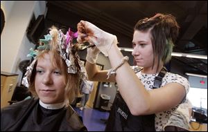 NBRW penta02p   09/28/2008 The Blade/Dave Zapotosky Caption: Ashley Gase, 17, a student at the Penta Career Center in Perrysburg, Ohio, gets her hair colored by Samantha Horn 18, a Penta graduate, during the school's open house Sunday, September 28, 2008.  Gase is from Monclova Township.  Her home school is Anthony Wayne.  Horn lives in Whitehouse.  She graduated last year but attended the old Penta location.  Summary: Open house at the Penta Career Center.