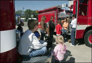 NBRN morenci09p Lisa Dutton/ The Toledo Blade   Morenci, MI 10/04/2008 Eight year old Aaron Newland waits patiently for his turn to take a fire truck ride during the open house. Morenci Fire Department  held an open house in honor their 175 years of service to the community.