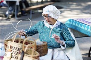 Slug: NBRE swamp09p                             Date: 10/05/2008             The Blade/Amy E. Voigt                     Location: Oregon, Ohio  CAPTION:  Maumee Bay Basket Weaver's Guild member Kathy Clark, from Oregon, weaves a basket during the Black Swamp Festival at Pearson Park, Packer-Hammersmith Center on October 5, 2008 in Oregon. The free event included crafts, artisan demonstrations and entertainment.