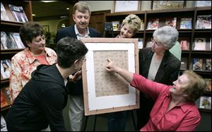 NBRW puzzle09p    00/01/2008     Blade Photo/Lori King  from left: Sharon Kolb, Helen Smith, David Dishop, RoseAnn Rittenhouse, Sandy Matheny and Gloria Forrest;  1957 Wauseon graduates who signed the back of this 80-piece Ottawa Indian Chief Wauseon puzzle, which is being  presented to the Wauseon Library in Wauseon, OH.