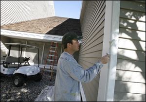 Eric Galinski of Toledo is among the workers sprucing up the Maumee Bay resort for a special guest, who is reported to be Democratic presidential nominee Barack Obama.