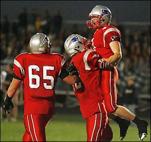 Patrick Henry's Luke George celebrates scoring a touchdown with teammates Brad Yarnell (65) and Cody Pettit during their NWOAL game with Archbold last night.
<BR>
<img src=http://www.toledoblade.com/graphics/icons/photo.gif> <b>HIGH SCHOOL FOOTBALL WEEK 8:</b> View <a href=http://www.toledoblade.com/apps/pbcs.dll/gallery?Avis=TO&Dato=20081011&Kategori=SPORTS12&Lopenr=101109997&Ref=PH><b><font color=red> Archbold - Patrick Henry </font color=red> </b></a> football photo gallery 