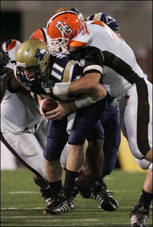 Bowling Green's Joe Schaefer sacks Akron's Chris Jacquemain during the fourth quarter to help the Falcons get the victory.