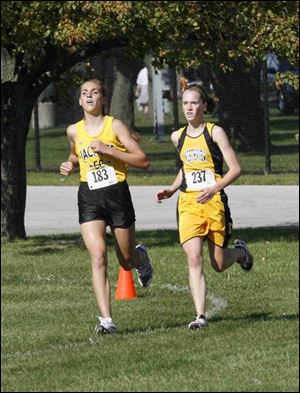 Winner Meredith Wagner (237) finished in tears as Kaitlyn Llewellyn fell at finish line. 