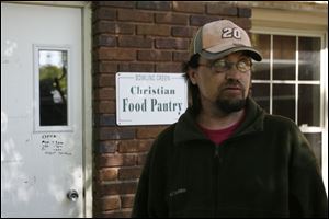 Wayne English of Bowling Green recently sought food pantry
assistance for his daughter and himself after he was laid off. (THE BLADE/JETTA FRASER)
<br>
<img src=http://www.toledoblade.com/graphics/icons/photo.gif> <b><font color=red>VIEW</b></font color=red>: <a href=