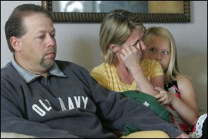 'There's nothing worse than the pain of losing a son,' says Louis Takacs, with his wife, Nancy, and their daughter, Ashlyn. 