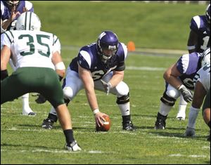 St. John's Jesuit graduate Ben Burkett lines up at center for Northwestern University. Burkett missed his freshman year with an injury, but is a central part of the team's 6-1 start this year.