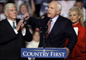 Sen. John McCain is flanked by wife Cindy and Jack Kemp, 1996 GOP vice presidential candidate, at a rally near Dayton.