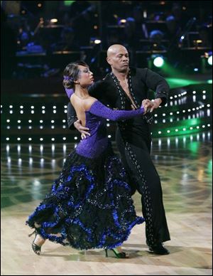Cheryl Burke and Maurice
Greene dance the paso doble.
