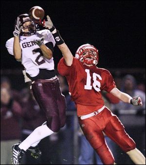 Genoa s Zach Apel makes a catch against Eastwood s Nick Schmeltz. Apel has 41 receptions for 768 yards and 12 touchdowns. He was voted Division IV all-district first team.