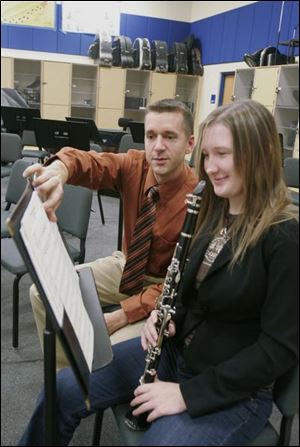 Perrysburg High band director Scott Schleuter instructs Krysten Jablonowski.