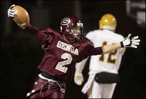 Genoa's Zach Apel scores against Kettering Alter in a D-IV state semifinal. Genoa lost 42-34.