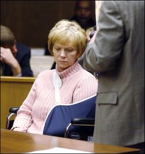Theresa Holman, in a wheelchair, is arraigned on two misdemeanor counts of vehicular manslaughter.