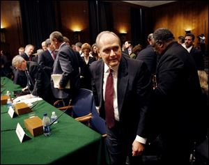 Chrysler Chief Executive Officer Robert Nardelli leaves the witness table on Capitol Hill in Washington on Thursday after testifying before a Senate Banking Committee hearing on the auto industry bailout. 